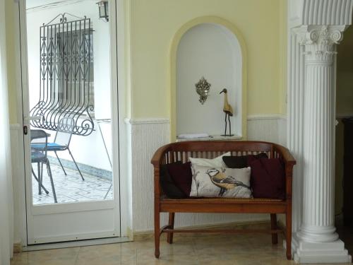 a chair with a pillow on it in a room at Villa Denia in Denia