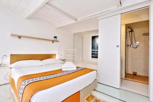 Ένα ή περισσότερα κρεβάτια σε δωμάτιο στο Design Loft Campo dei Fiori