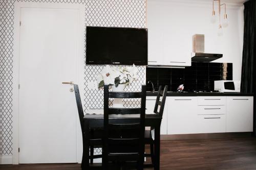 Kuchyň nebo kuchyňský kout v ubytování Residence Cavour 63