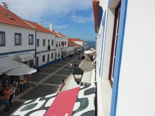 a view from a window of a street with buildings at Porto Covo / Costa Alentejana in Porto Covo