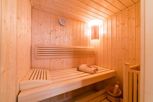 a wooden sauna with a bench in it at Sun Spalato Views in Split