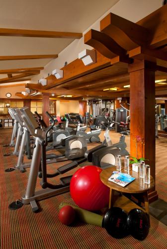 a gym with a bunch of exercise equipment in a room at Lodge at Vail, A RockResort in Vail