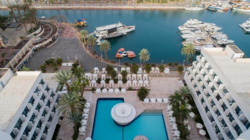 an aerial view of a hotel with a marina at Lagoona by Isrotel Collection in Eilat
