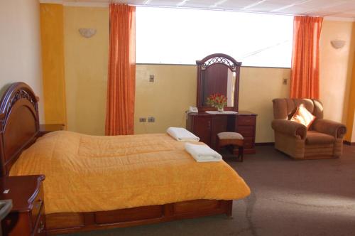 Ένα ή περισσότερα κρεβάτια σε δωμάτιο στο Hostal Tukos La Casa Real