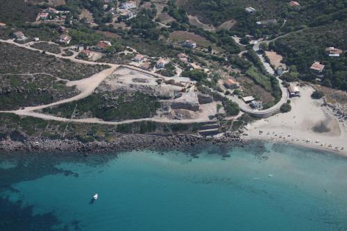 an aerial view of a beach and the ocean at Guardia dei Mori in Carloforte
