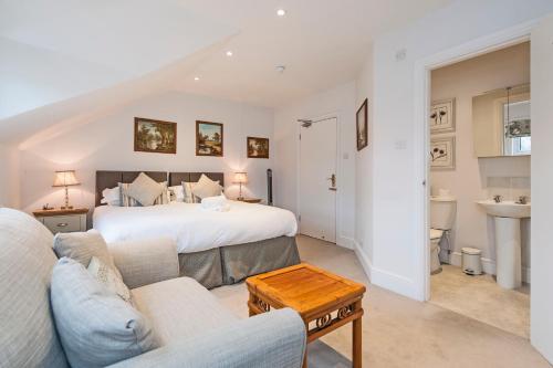 a bedroom with a bed and a living room at Apple Tree boutique B&B in Bath