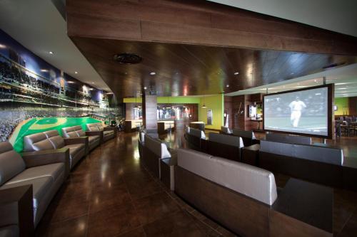 a room with couches and a flat screen tv at Barceló Bávaro Palace All Inclusive in Punta Cana