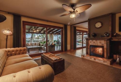 a living room with a couch and a fireplace at Finca Santa Maria in Callao Salvaje