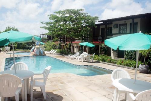 בריכת השחייה שנמצאת ב-Taperapuan Praia Hotel או באזור