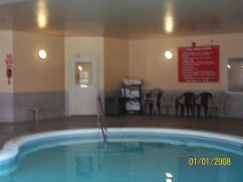 a large swimming pool in a hotel room at Days Inn by Wyndham Moose Jaw in Moose Jaw