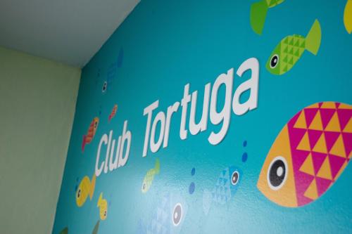 a sign on the wall of a room with fishes at BSEA Cancun Plaza Hotel in Cancún