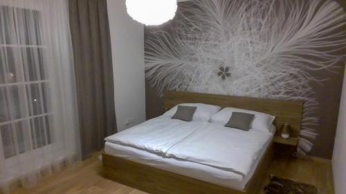 Postel nebo postele na pokoji v ubytování Nový Apartmán Říčky