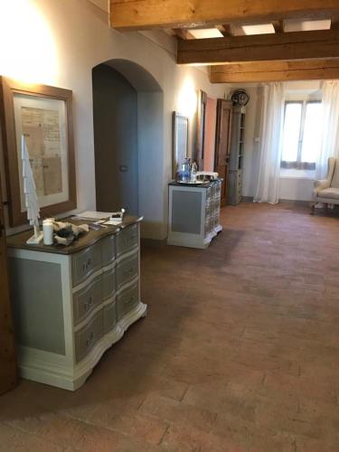 a large room with a dresser in a room with at B&B Arcadia in Gualtieri