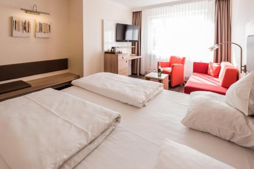Hotel an der Linah garniにあるベッド