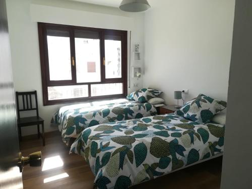 Postel nebo postele na pokoji v ubytování Apartamento Polo Flat