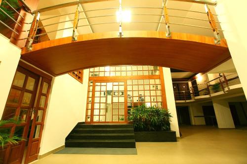 an entrance to a building with a revolving door at Hotel Pearl Palace in Cochin