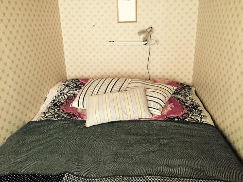 Een bed of bedden in een kamer bij Citymökki