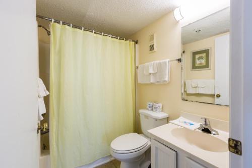a bathroom with a toilet and a sink and a shower at Windy Shores II in Myrtle Beach
