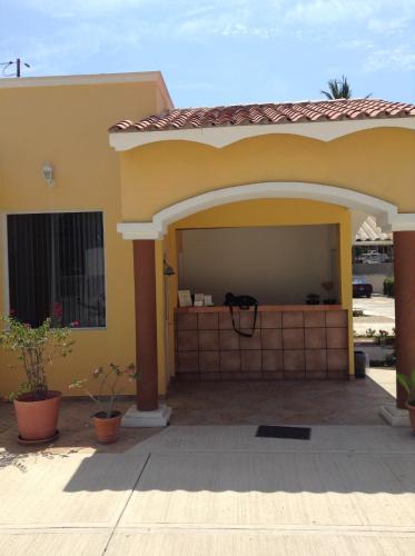 a garage in a house with an archway at Paraiso del Pescador in Rincon de Guayabitos
