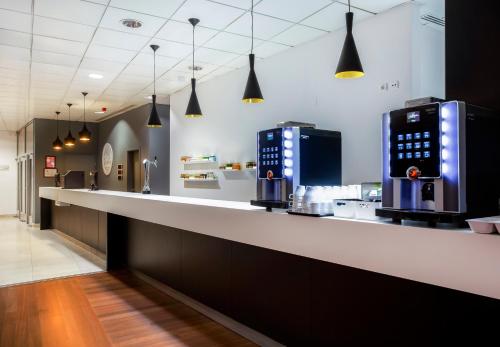a kitchen with a counter with two machines on it at B&B HOTEL Cantanhede Coimbra in Cantanhede
