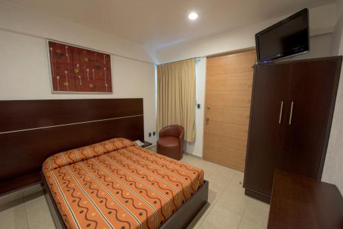 Μια τηλεόραση ή/και κέντρο ψυχαγωγίας στο Hotel Oaxaca Inn Express