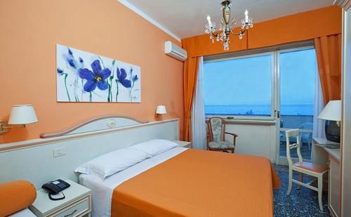 Postel nebo postele na pokoji v ubytování Hotel Hollywood