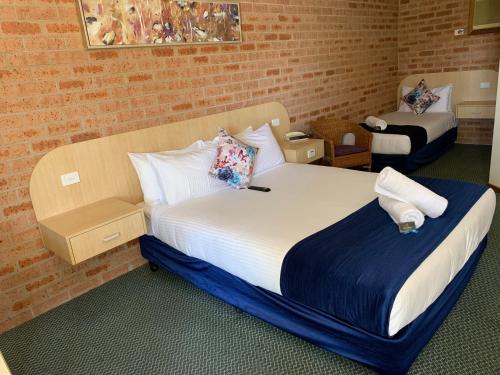 Ένα ή περισσότερα κρεβάτια σε δωμάτιο στο Branxton House Motel