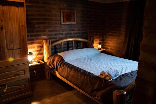 a bedroom with a wooden bed in a room at Patagonia Retro in Esquel
