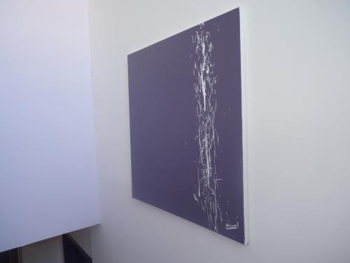 a picture hanging on a white wall at Résidence Honoré de Balzac in Brest