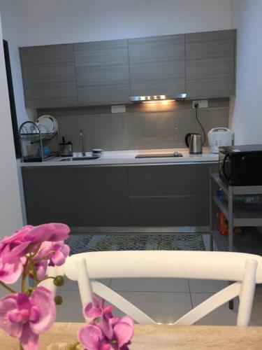 a kitchen with a sink and a counter top at Emira Residence Sek 13 Shah Alam Wi-Fi Netflix in Shah Alam