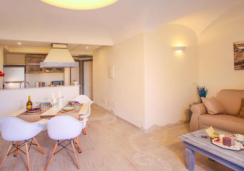 a living room with a table and a couch at Villa Caruso in Ischia