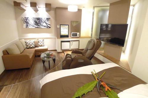 TV a/nebo společenská místnost v ubytování Hotel GOLF Nirasaki (Adult Only)