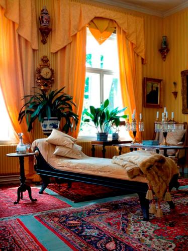 a bedroom with a bed and a window at Hotel Töyrylä Manor in Artjärvi