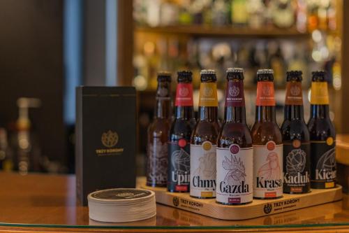 a row of bottles of beer sitting on a table at Hotel Batory in Szczawnica