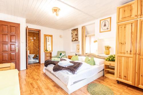 a living room with a white couch in a room at Kaktusz Villa Heviz in Hévíz