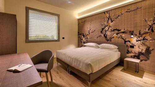 Postel nebo postele na pokoji v ubytování Hotel The Cube