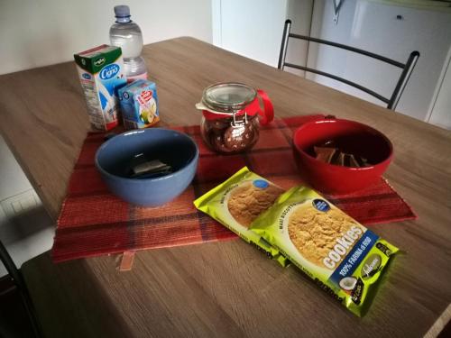 a table with some food on a wooden table at Blue Apartment in Pescara