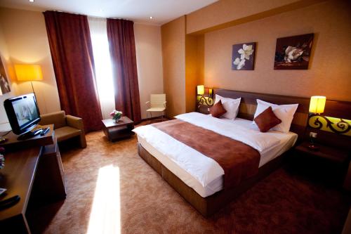 Katil atau katil-katil dalam bilik di Top Rooms Aparthotel