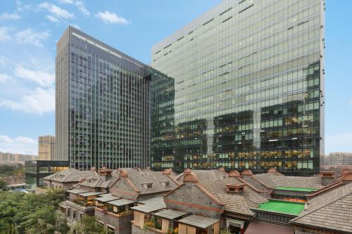 a view of a city with tall buildings and roofs at Hyatt Place Chengdu Pebble Walk in Chengdu