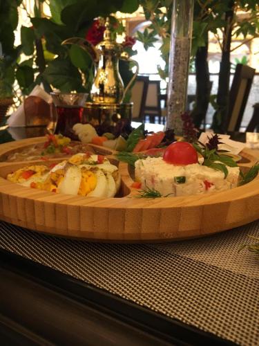 a plate of food sitting on a table at Shally Residence 3 in Al Khobar