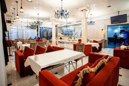ห้องอาหารหรือที่รับประทานอาหารของ Almaty Grand Erbil Hotel