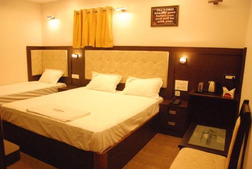 Le Emerald Residencyにあるベッド