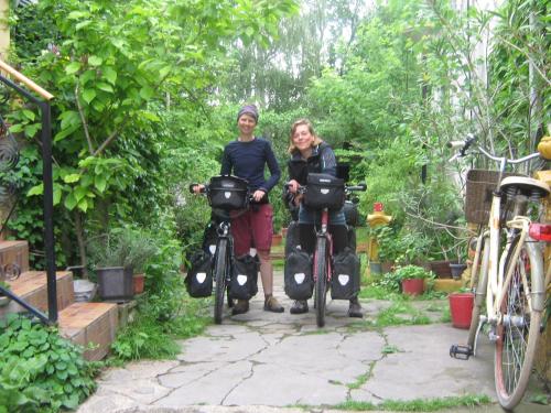a man and a woman standing next to their bikes at Base for Adventurers - Urban Guerrilla in Negotin