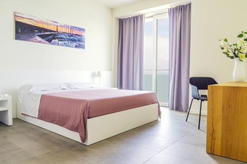 Postel nebo postele na pokoji v ubytování Garda Rooms