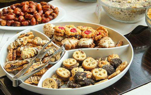 a table with two bowls of different types of pastries at Victoria Hotel Borovets - Free Parking in Borovets