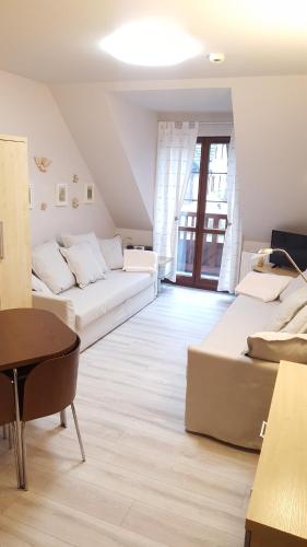 Ένα ή περισσότερα κρεβάτια σε δωμάτιο στο Apartment 32 Bombonierka Pod Aniołem