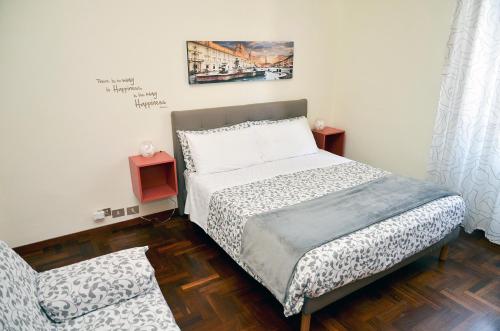 a small bedroom with a bed and a chair at B&B Lost in Trastevere in Rome
