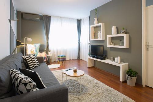 a living room with a couch and a table at Apartment Ciglica in Zagreb