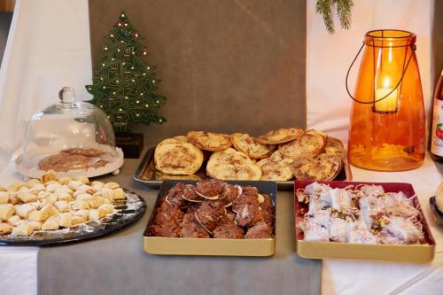 
a table topped with lots of different types of pastries at Holzwerk Oybin in Kurort Oybin
