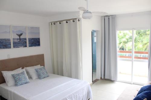 Postel nebo postele na pokoji v ubytování Murakami Pousada